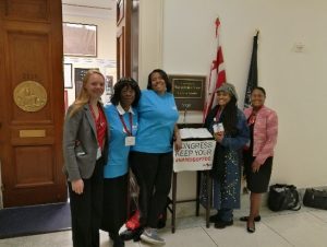 Group of women in front of door