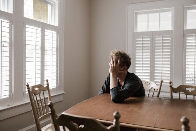 depressed person sitting alone